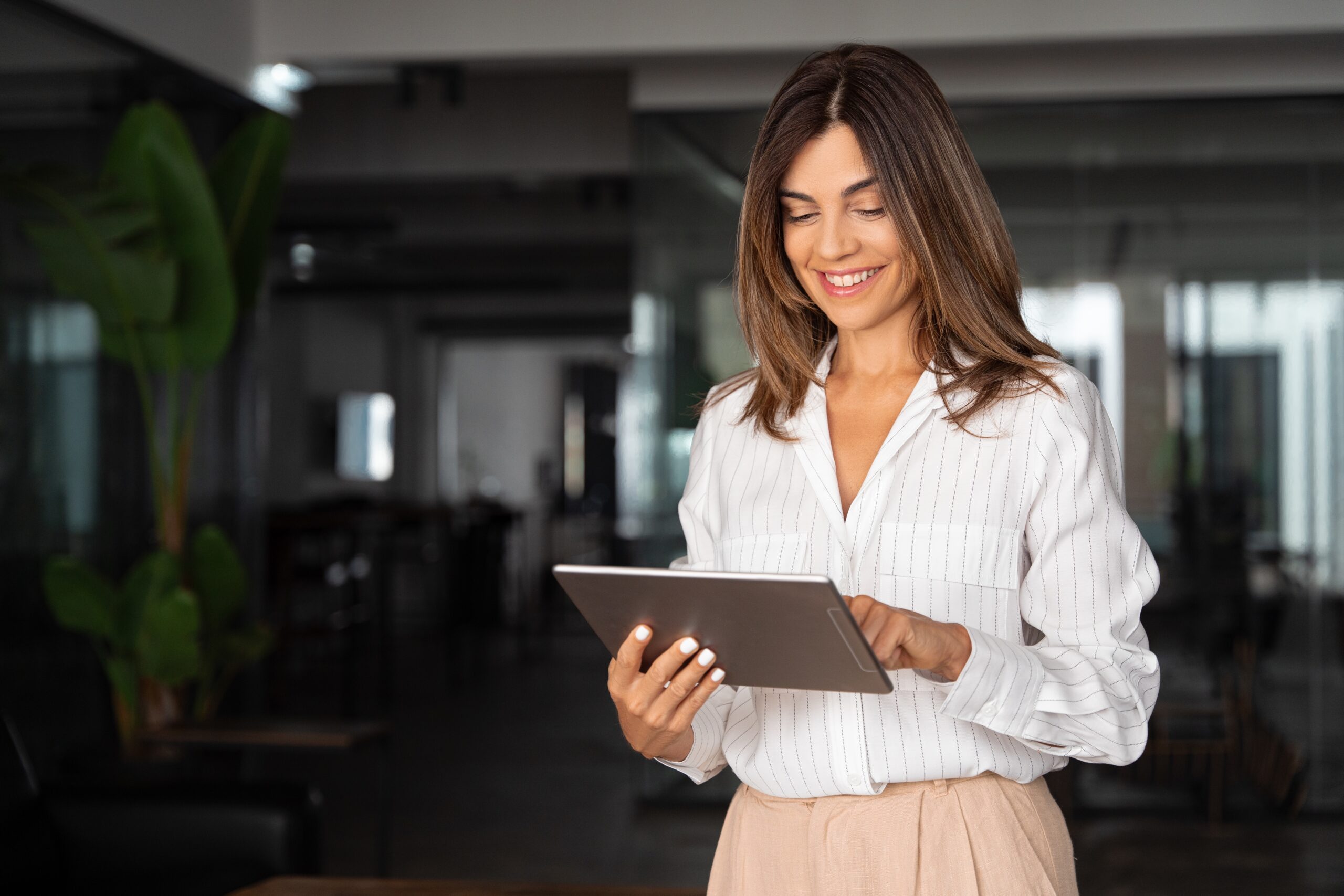 Smiling woman with iPad